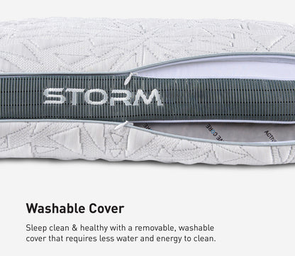 Close-up of a Storm pillow cover with a gray zipper and the word STORM across it, plus text below reading 'Washable Cover' with a descriptive marketing note.