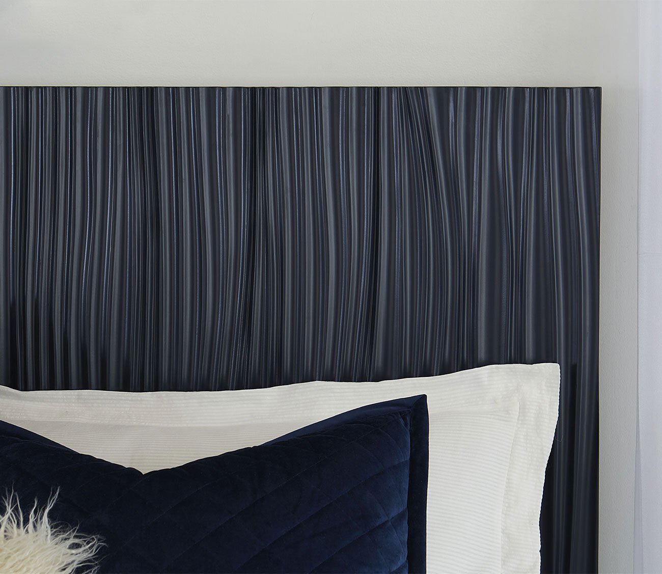 Close-up of Argento Oak Platform Bed's headboard in navy
