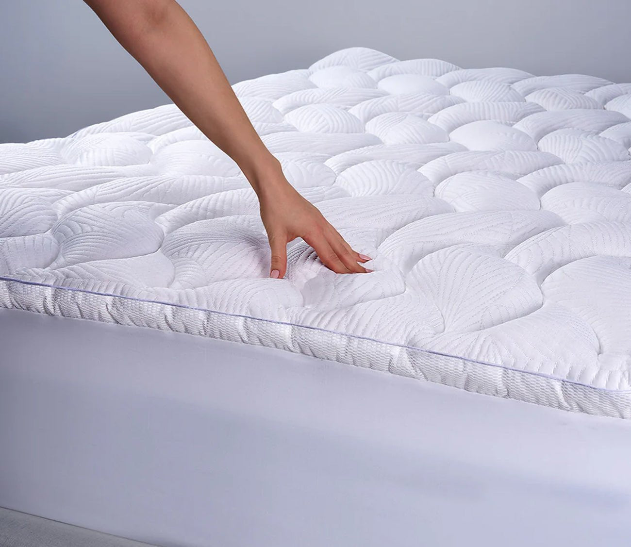 Bedgear React Pro Performance Mattress Topper by Bedgear, model pressing topper to show comfort