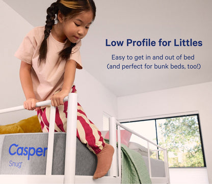Child sitting on Casper Snug Kid's Mattress by Casper