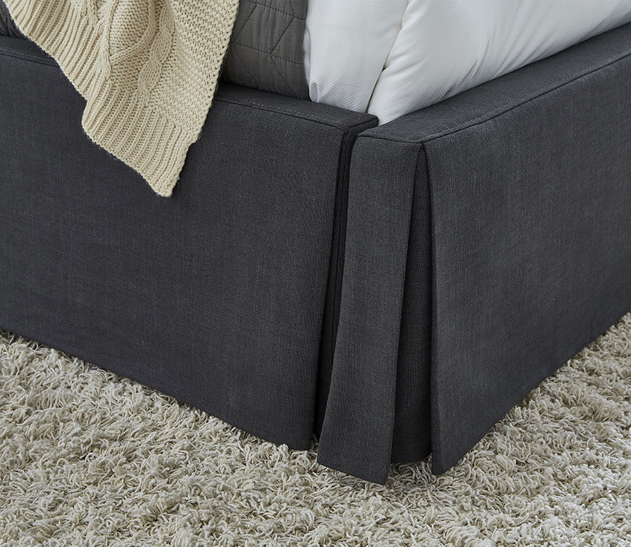Cheviot Upholstered Skirted Storage Panel Bed - skirt close-up