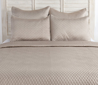 Diamond Pebble Sateen Quilted Pillow Sham by Villa by Classic Home, on bed