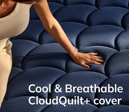 Hand pressing on DreamCloud 4.0 Ultra Hybrid Mattress by DreamCloud showcasing its cool and breathable CloudQuilt+cover.