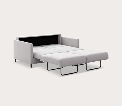 Queen size Elfin Sleeper Sofa in light gray fully extended into a bed with a pull-out sleeping surface - angled