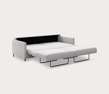 Elfin Sleeper Sofa in light gray fully extended into a bed with a pull-out sleeping surface - angled