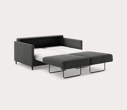 Queen Elfin Sleeper Sofa in dark gray fully extended into a bed with a pull-out sleeping surface - angled