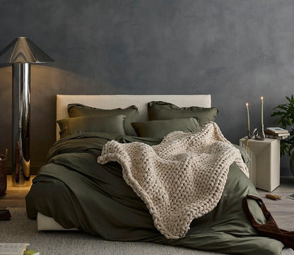 Hush Knit Weighted Blanket by Hush Blankets in champagne, on bed