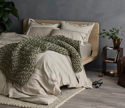 Hush Knit Weighted Blanket by Hush Blankets in olive on bed
