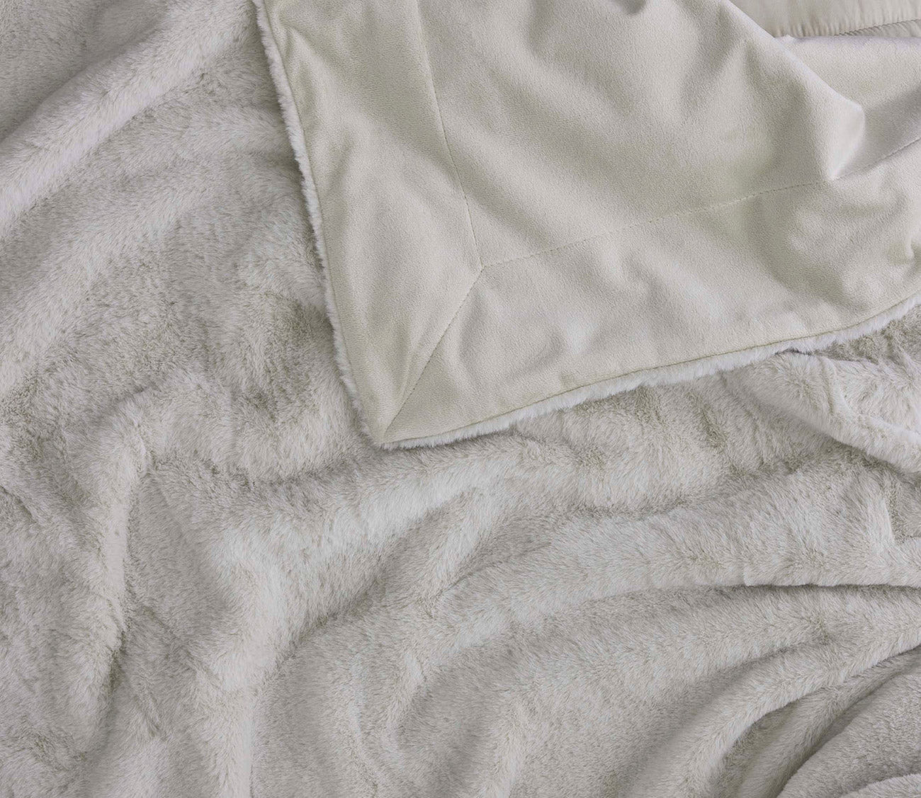 Hush Luxe Throw by Hush Blankets, in ivory, reverse shown with fleecy soft fabric