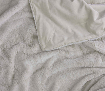 Hush Luxe Throw by Hush Blankets, in ivory, reverse shown with fleecy soft fabric