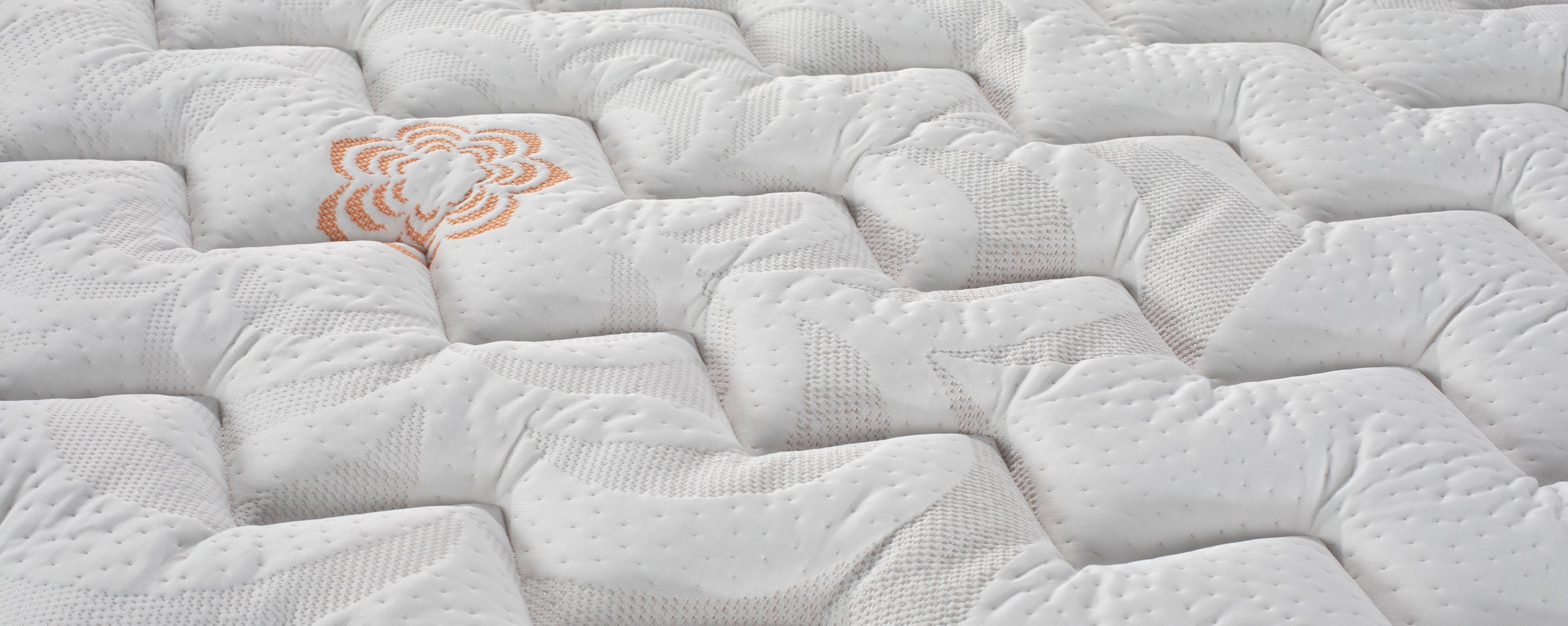 Close-up of Karma Elite Hybrid Firm Mattress.
