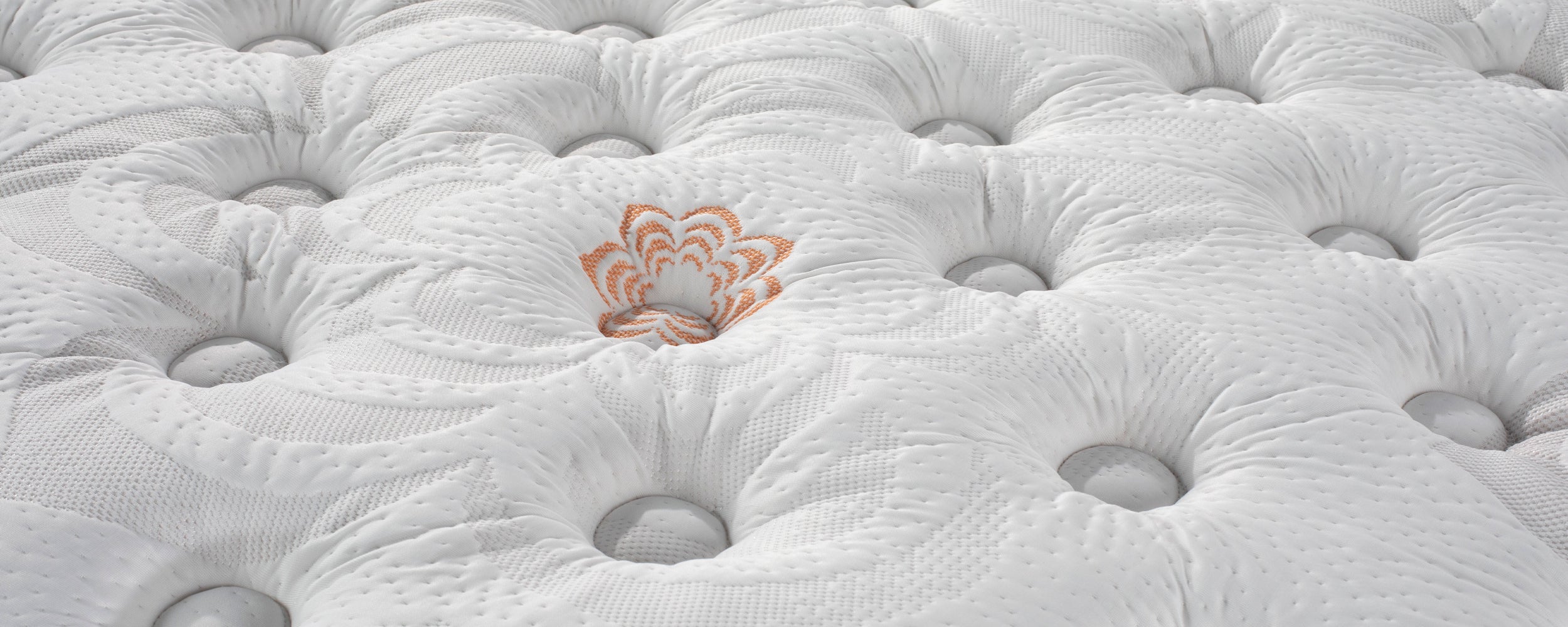 Close-up of Karma Elite Hybrid Plush Mattress.