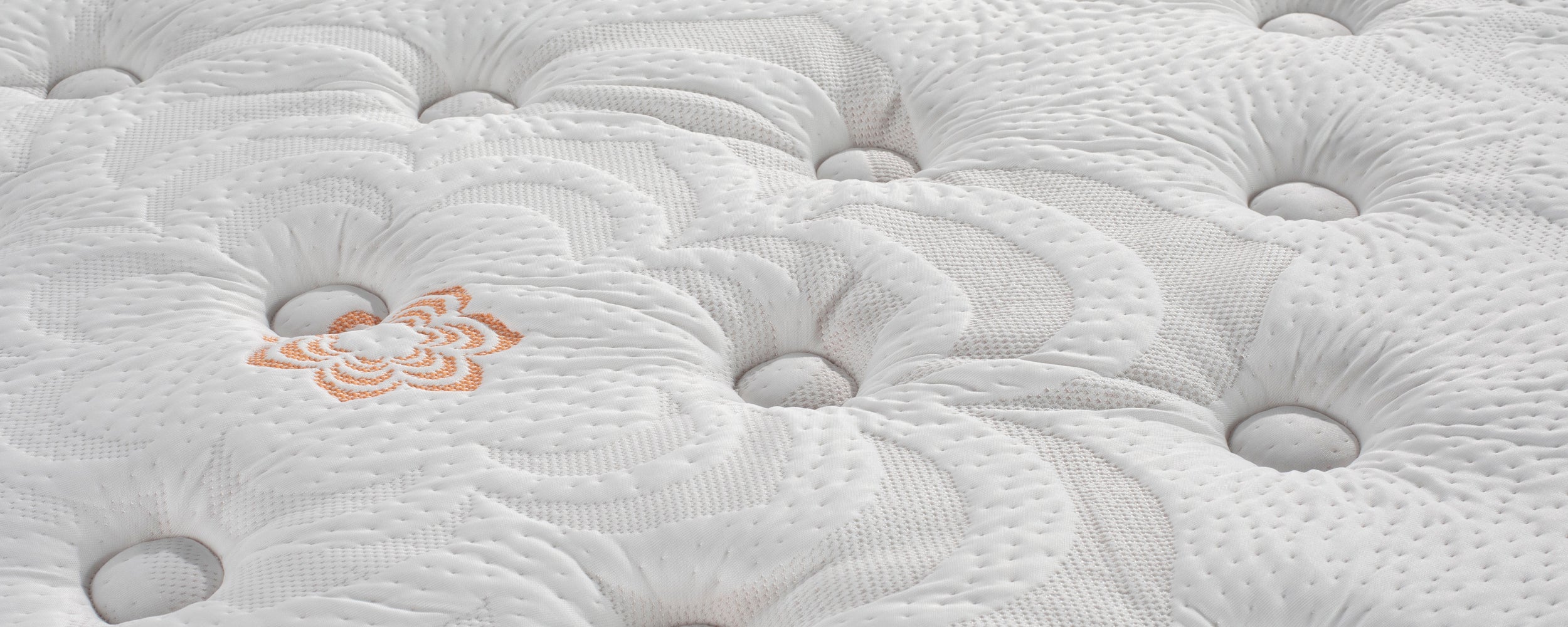 Close-up of Karma Select Hybrid Plush Mattress.