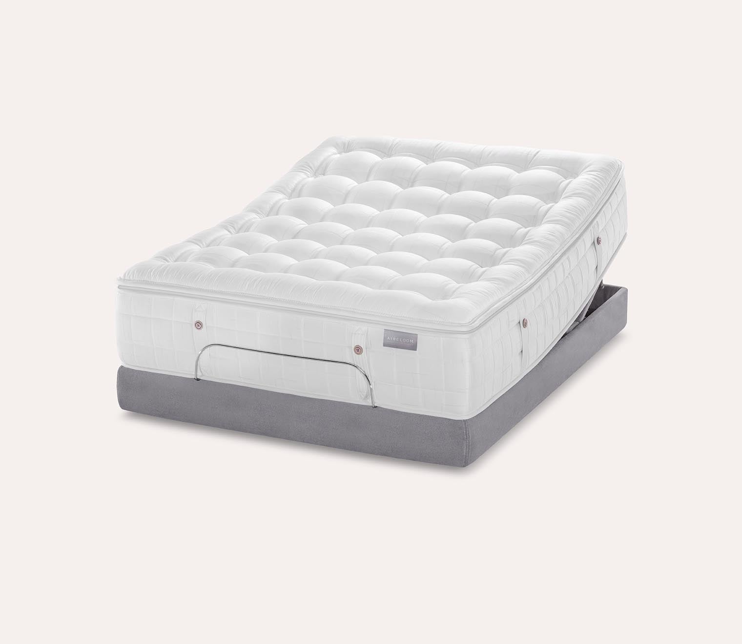 Silo image of Karpen Dove Luxetop Plush Mattress on an adjustable base.