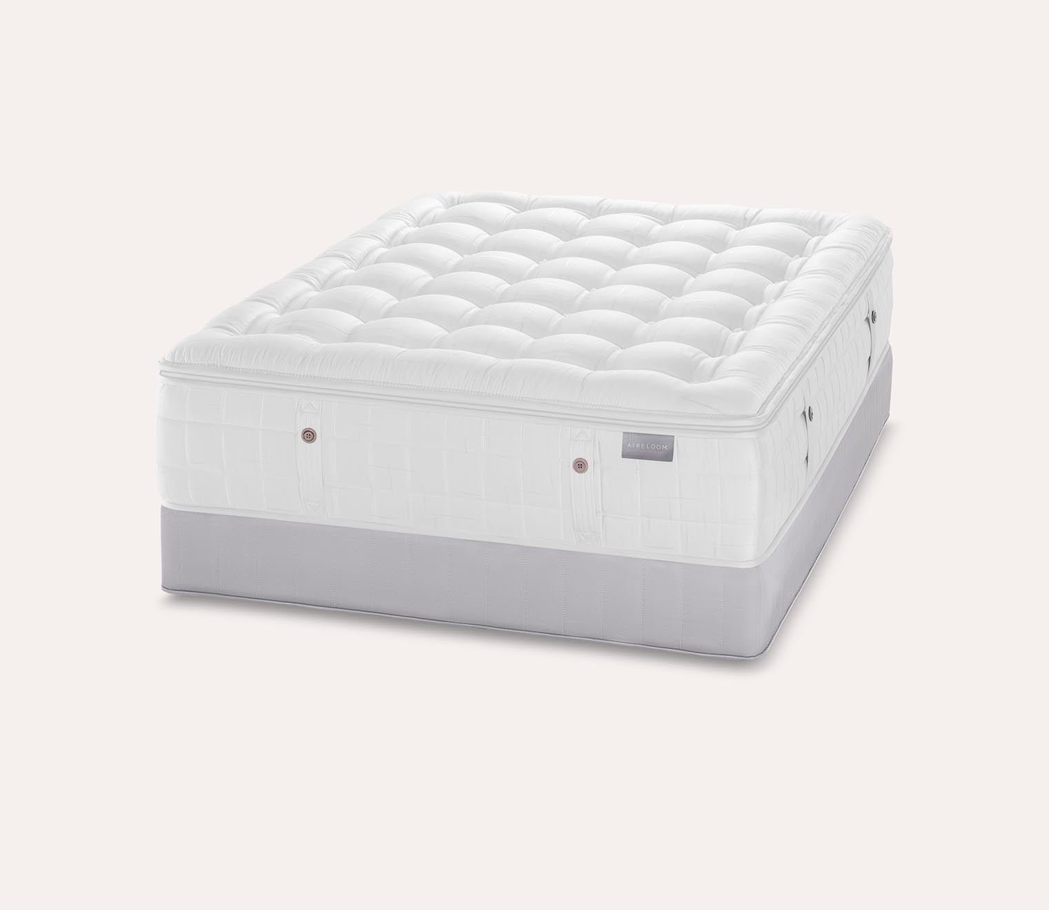 Silo image of Karpen Dove Luxetop Plush Mattress set on a standard foundation.