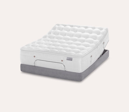 Silo image of Karpen Ivory Luxetop Firm Mattress on an adjustable base.