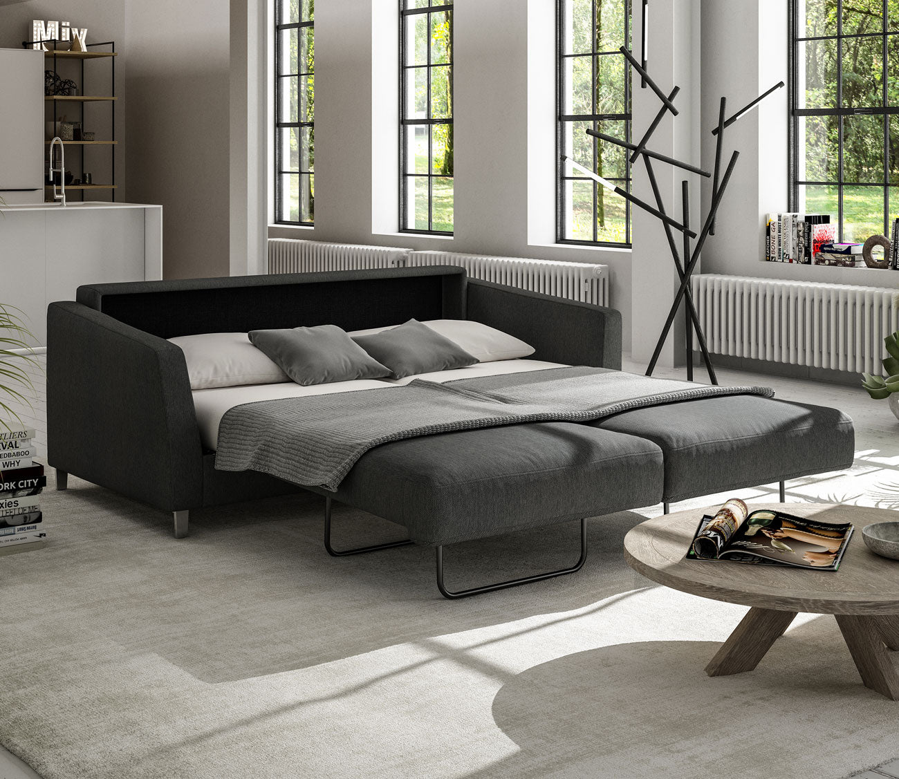 Monika Sofa Sleeper by Luonto in charcoal, bed open in room