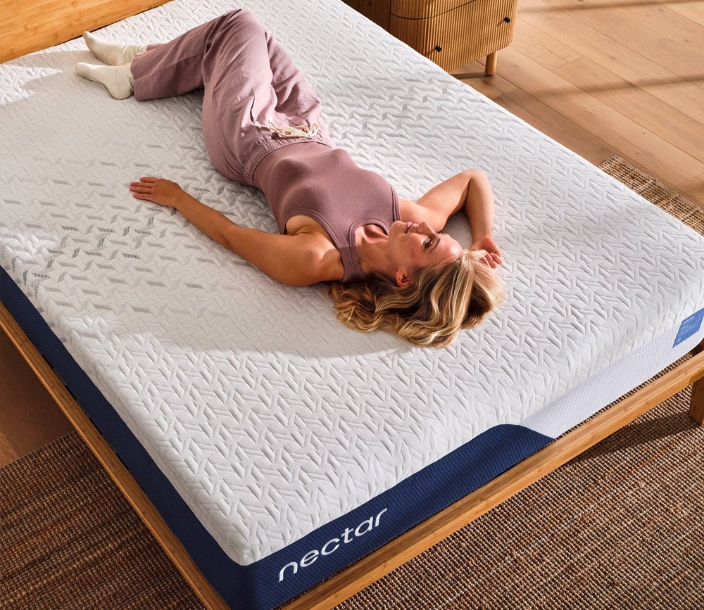 Woman relaxing comfortably on Nectar 5.1 Classic Memory Foam Mattress.