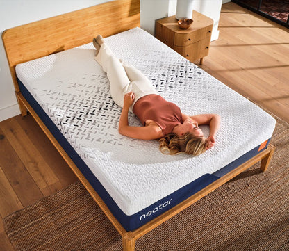 Overhead view of a woman relaxing on a Nectar mattress.