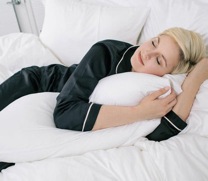 Night Song Down Alternative Body Pillow by City Mattress, woman resting on body pillow