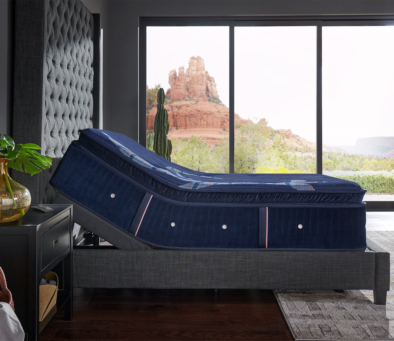 Reserve Plush Euro Pillow Top Mattress on an adjustable base in a lifestyle setting - side view.
