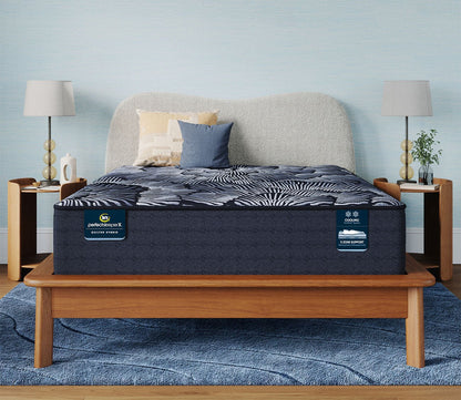 Serta Perfect Sleeper Coral Shores Quilted Plush Hybrid Mattress on a platform bed in a bedroom setting.