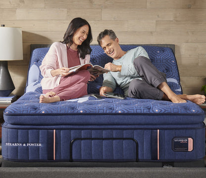 Couple reading together on a Stearns & Foster Lux Estate Plush Euro Pillow Top mattress.