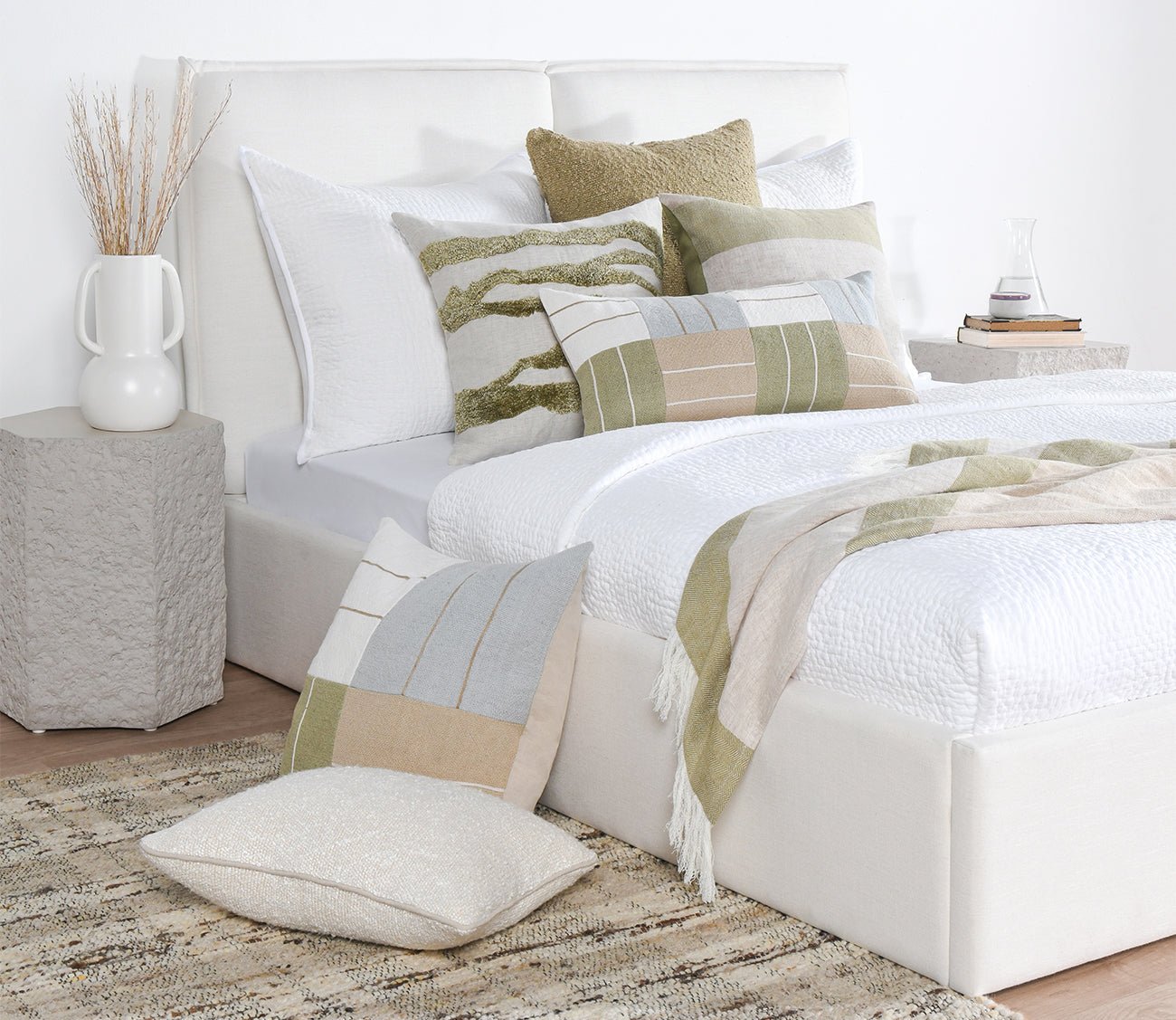 Talara Crafted Throw Blanket by Villa by Classic Home in green on bed