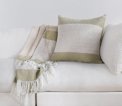 Talara Crafted Throw Blanket by Villa by Classic Home in green on sofa