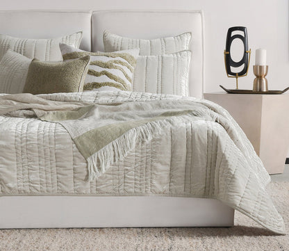 Talara Crafted Throw Blanket by Villa by Classic Home in green in bedroom